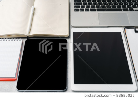 Office supplies and digital tablet on office table Office supplies and digital tablet on office table 88683025