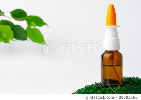 Cosmetics in a bottle, essential oil on moss Cosmetics in a bottle, essential oil on moss 88683166
