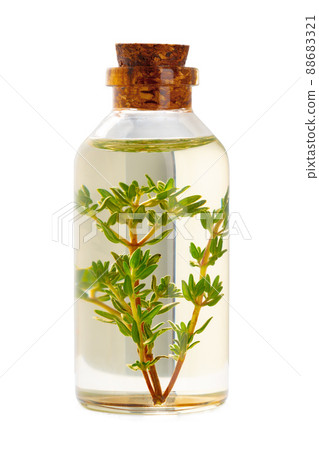 Bottle of essential oil isolated on white background 88683321