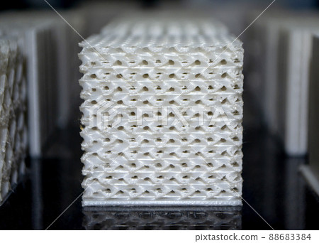White models prototypes printed on a 3D printer from plastic close-up White models prototypes printed on a 3D printer from plastic close-up 88683384