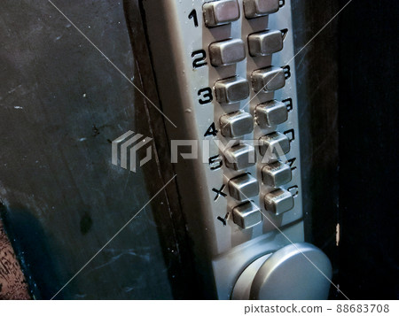 Grey silver number keypads security door locker on black door 88683708