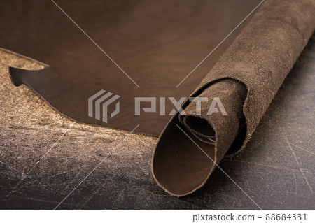 Roll of natural brown leather. Material for manufacture of bags, shoes, clothing and accessories. 88684331