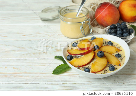 Concept of healthy food with peach yogurt on white wooden table Concept of healthy food with peach yogurt on white wooden table 88685110