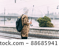 People waiting at the train platform 88685941