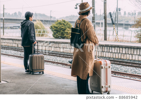 People waiting at the train platform People waiting at the train platform 88685942