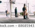 People waiting at the train platform 88685943