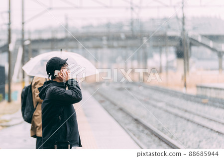 People waiting at the train platform People waiting at the train platform 88685944