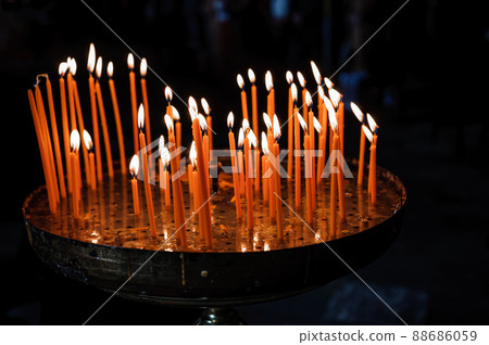 stand with candles in the church 88686059