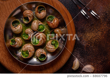 Bourgogne Escargot Snails with herb garlic oil. Bourgogne Escargot Snails with herb garlic oil. 88687796