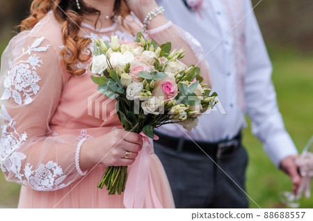 Bouquet of flowers in the hand of the bride Bouquet of flowers in the hand of the bride 88688557
