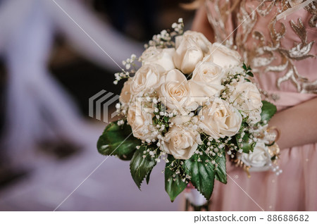 Bouquet of flowers in the hand of the bride 88688682