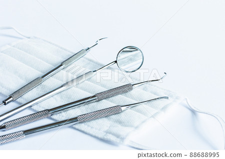 Doctor's dentistry tools for teeth dental care and treatment on white background. 88688995