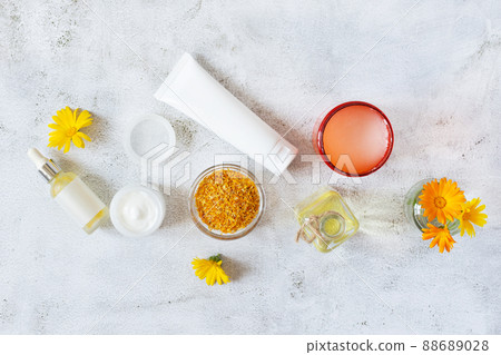 Herbal cosmetics with calendula flowers. Natural organic moisturizer cleansing product. Herbal cosmetics with calendula flowers. Natural organic moisturizer cleansing product. 88689028