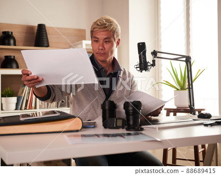 Graphic designer/photographer working in home office Graphic designer/photographer working in home office 88689415