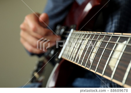 Musician playing on electric guitar, close up and selective focus Musician playing on electric guitar, close up and selective focus 88689678