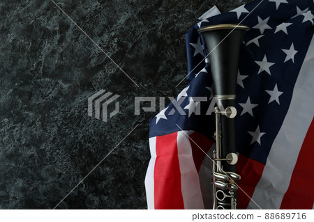 Clarinet and american flag on black smokey background Clarinet and american flag on black smokey background 88689716