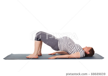 Pregnant woman doing yoga asana Purvottanasana 88689839