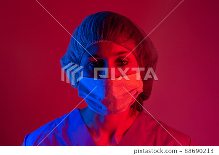 Nurse wearing respirator mask holding a blood test  for the new Coronavirus, covid-19. Coronavirus Pandemic Concept. 88690213