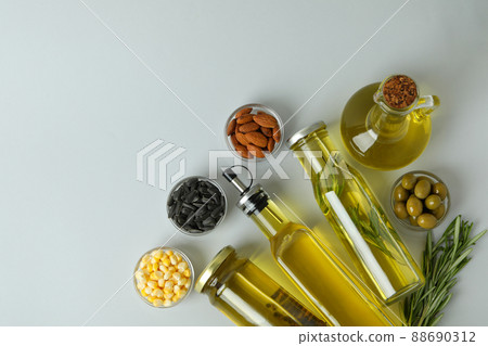 Set of different oils on light gray background 88690312
