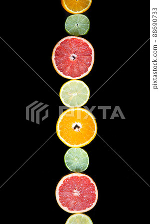 citrus slices, ,orange, lemon, lime, and grapefruit black background. Top view citrus slices, ,orange, lemon, lime, and grapefruit black background. Top view 88690733