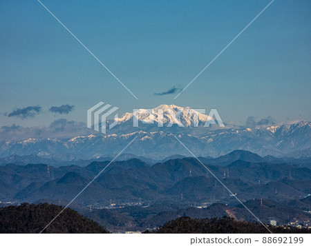 View from Gifu Castle castle tower Mt. Kiso Ontake in winter and the mountains in the foreground 88692199