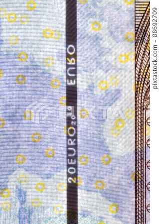 Plastic security strip inside 20 EUR banknote. Security strip on Euro banknote created to prevent counterfeiters. 88692709