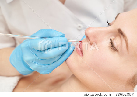 Permanent makeup. Beauty spa procedure. young woman. Face tattoo 88692897