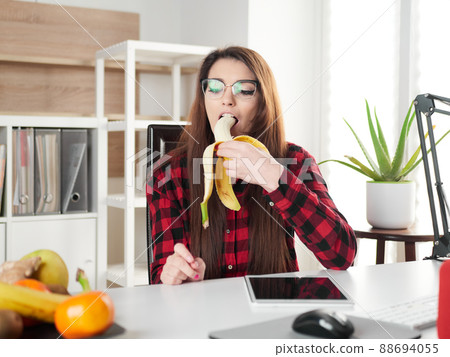 young woman take a break and eat a banana fruit 88694055