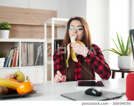 young woman take a break and eat a banana fruit 88694056