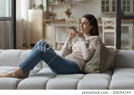 Positive smartphone user woman in casual having telephone 88694244