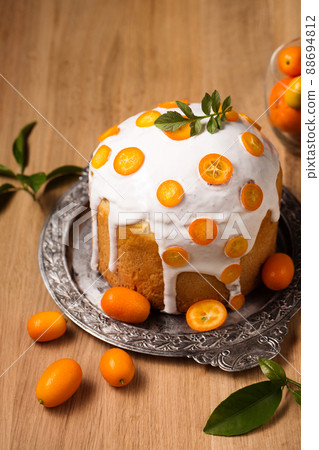 Easter cake with fruits on a wooden table Easter cake with fruits on a wooden table 88694812