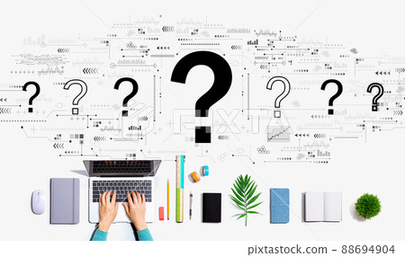 Question marks with person using a laptop 88694904