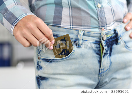 Woman hold credit card in jeans pocket, use card for contactless payment, online transaction Woman hold credit card in jeans pocket, use card for contactless payment, online transaction 88695691