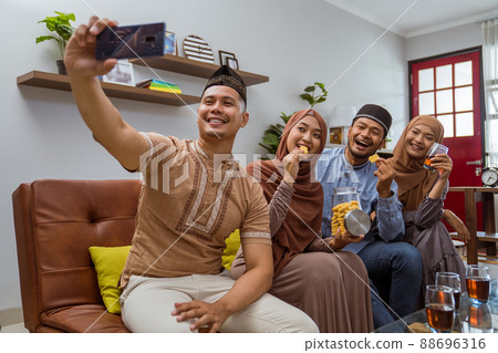 friend take selfie on eid mubarak islamic day 88696316