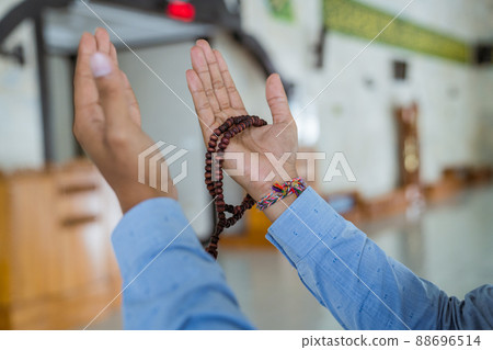 Man muslim doing prayer in the mosque 88696514