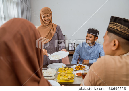 asian muslim friend and family break fasting together 88696528