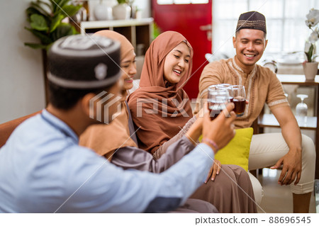 muslim cheering their glass celebrating eid mubarak together muslim cheering their glass celebrating eid mubarak together 88696545
