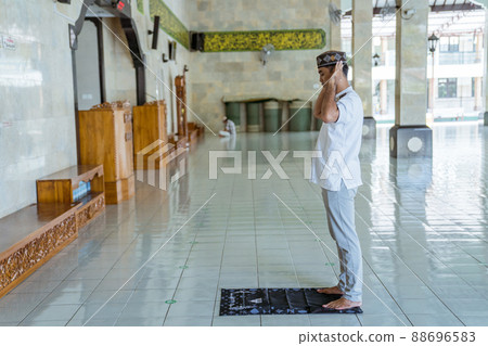 asian muslim man takbir solat at the mosque asian muslim man takbir solat at the mosque 88696583