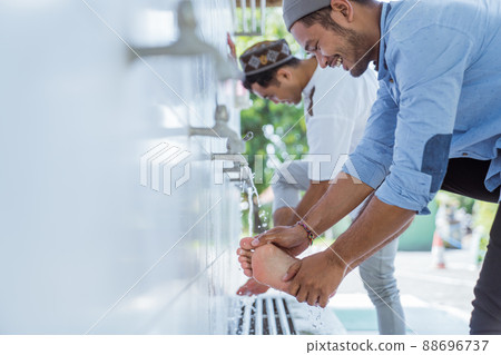 Man muslim perform ablution or wudu at the mosque 88696737