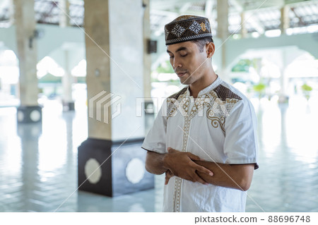 asian muslim man takbir solat at the mosque 88696748