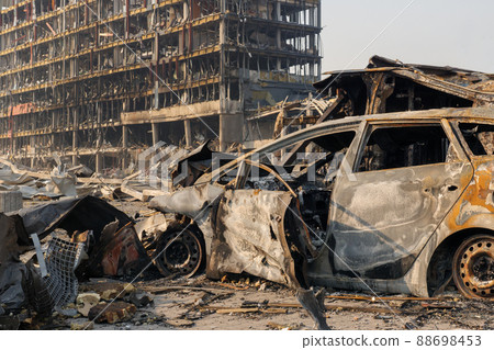 Aftermath shell of civilian bombed city damage car. 2022 Russian invasion of Ukraine war torn city destroyed car burn out. Bomb attack Russia war damage Ukraine city war destruction Russian aggression Aftermath shell of civilian bombed city damage car. 2022 Russian invasion of Ukraine war torn city destroyed car burn out. Bomb attack Russia war damage Ukraine city war destruction Russian aggression 88698453