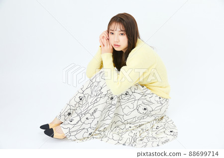 Young woman in knit girly fashion bangs bangs Young woman in knit girly fashion bangs bangs 88699714