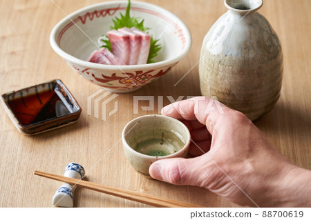 Sake poured into the choko 88700619
