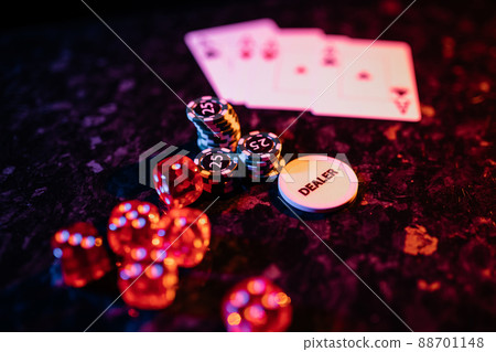 Dices and cards scattered on table. Casino concept Dices and cards scattered on table. Casino concept 88701148