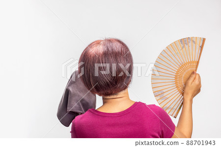 Middle aged woman feel hot flashes or overheated , symptoms of menopause 88701943