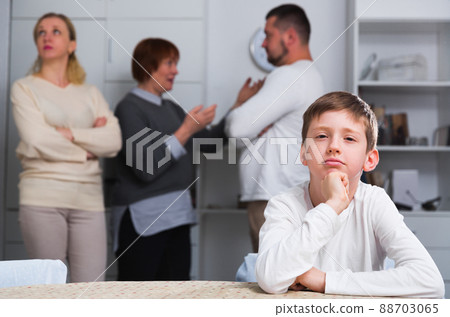Sad boy during parents quarrel 88703065