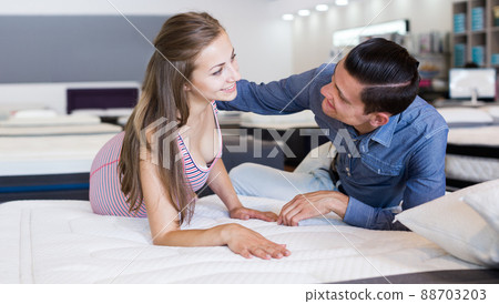 Man and woman choosing mattress 88703203