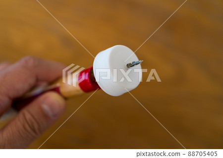 Make a hole in the PET bottle cap with a cone Make a hole in the PET bottle cap with a cone 88705405