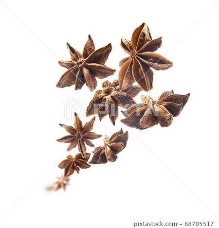 Anise stars levitate on a white background Anise stars levitate on a white background 88705517