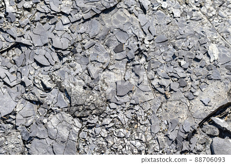 Natural ash with a texture of dark gray black coals. Rock. Space for text. 88706093